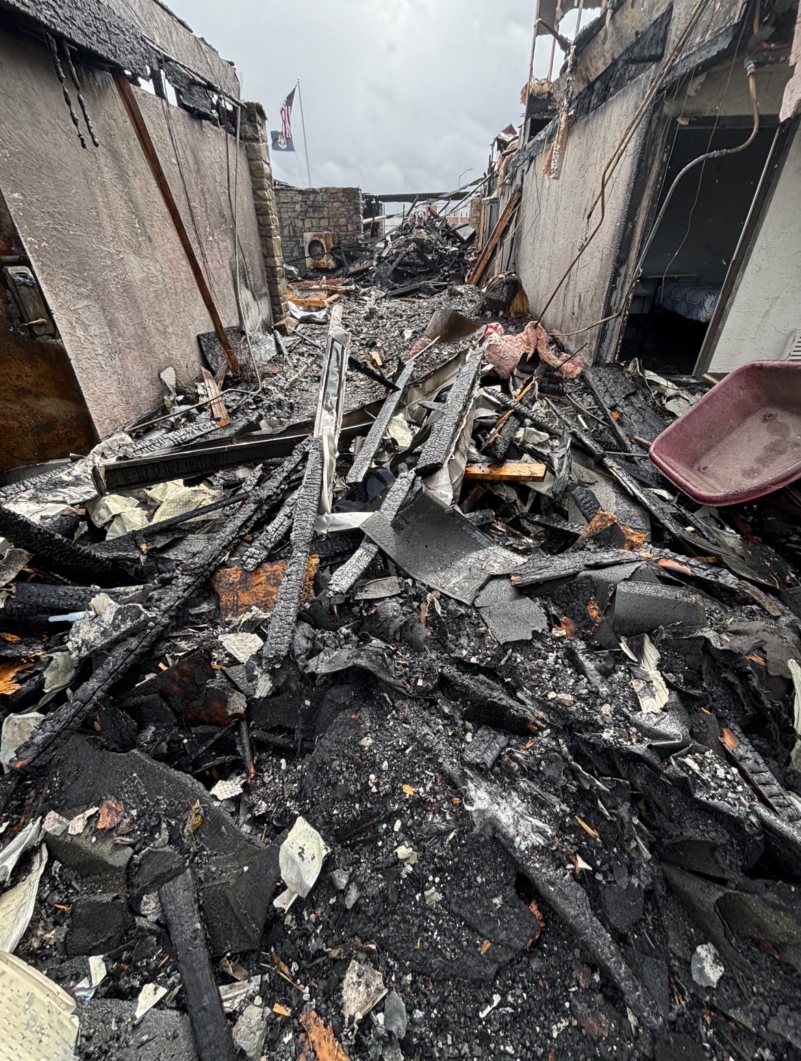 Commercial passage filled with debris before cleanup