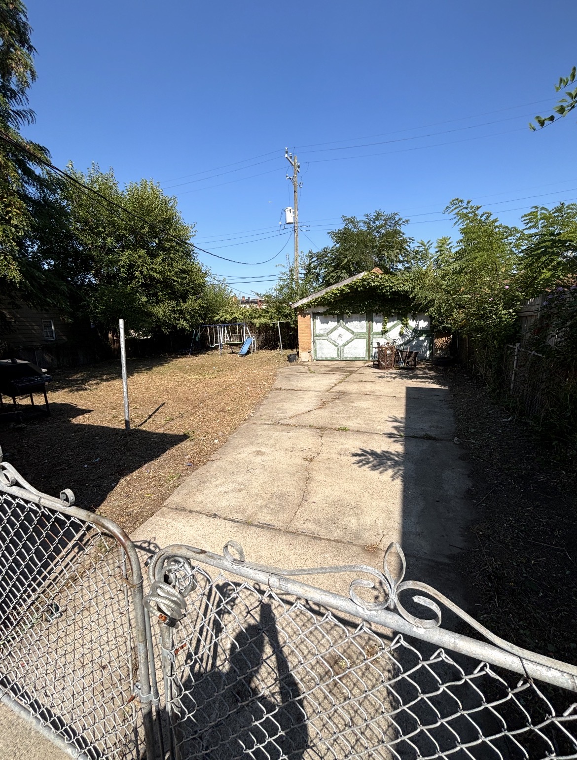 Cleared residential driveway after cleanup