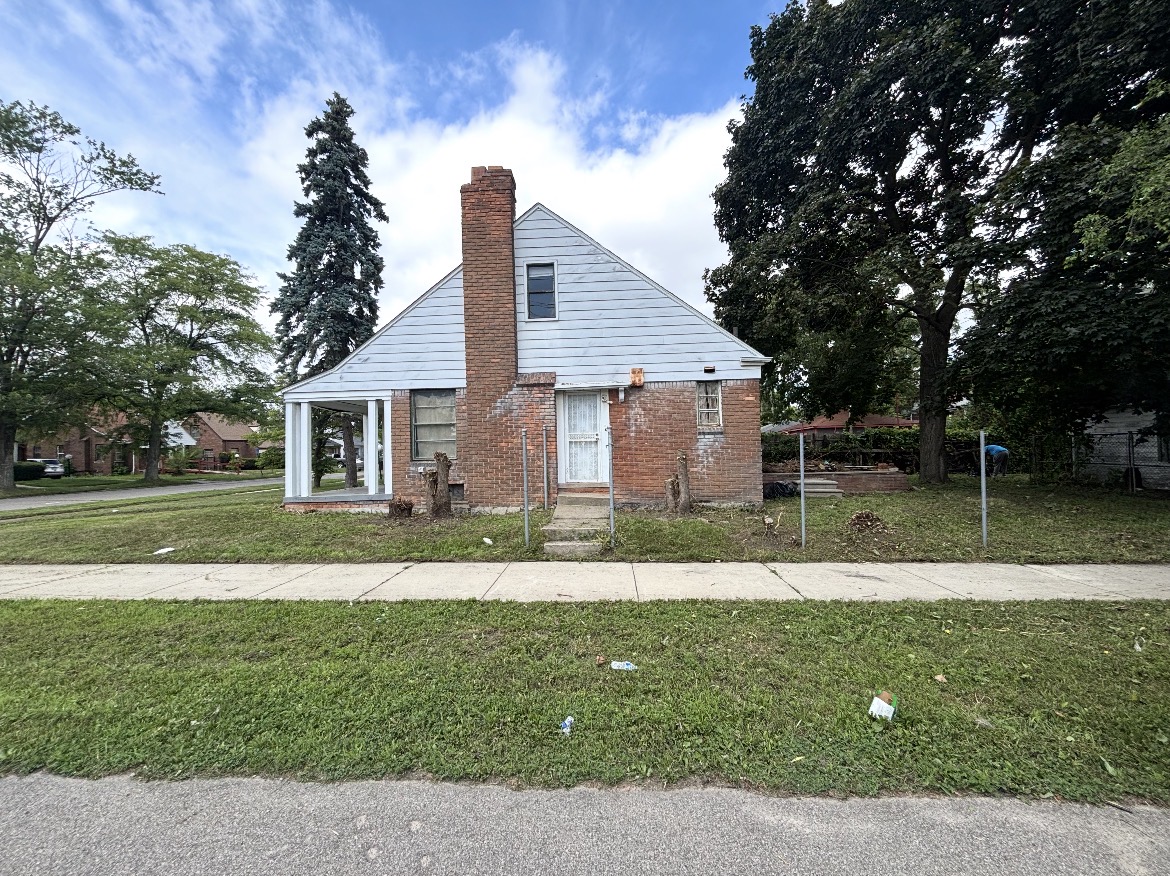 House and yard after clearing overgrowth